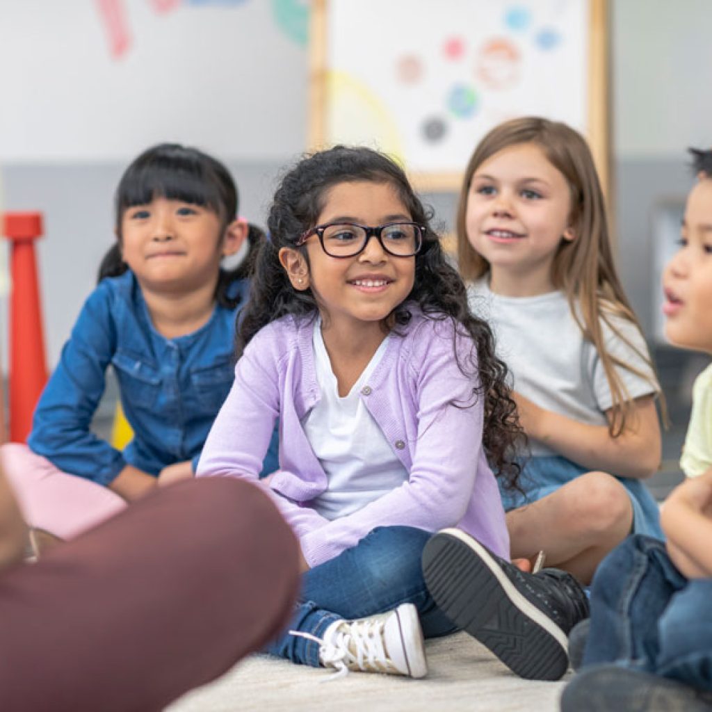 A group of kindergarten students in a Discovery Corner Academy classroom